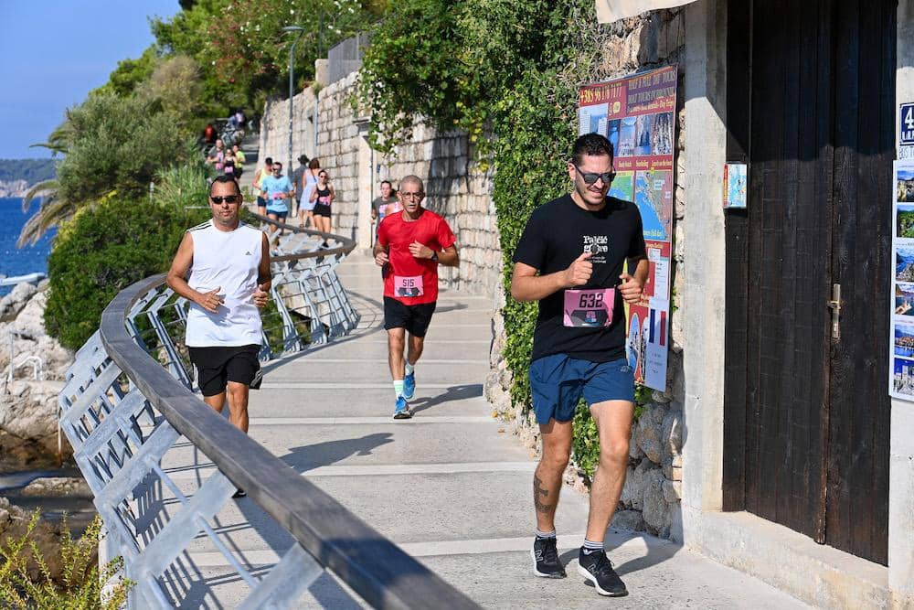 Runners on the Lapad peninsula walk taking part in Lapad Run in Dubrovnik